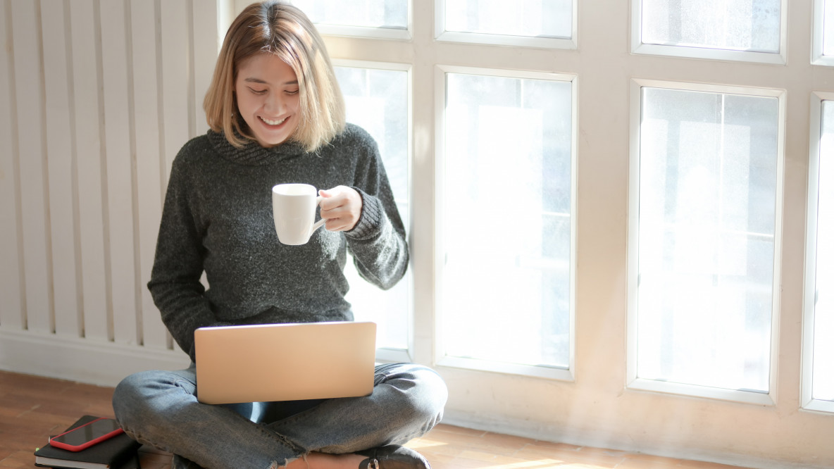 woman-in-gray-sweater-drinking-coffee